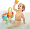 A young child is playing with a bath toy in a bathtub. Podgląd zdjęcia produktu