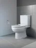 A white toilet in a modern bathroom with gray tiled walls and floor. Produktbild-Vorschau