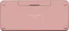 The back of a rose-colored keyboard is shown on a white background. Produktbild-Vorschau