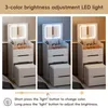 A collage of three images showing a white vanity table with a lighted mirror and a stool, demonstrating different light settings. Náhľad obrázku produktu