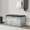 A bench with storage in an entryway, with boots and coats nearby. Náhled obrázku produktu