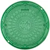 A green manhole cover with a decorative pattern and a central emblem. Produktbild-Vorschau