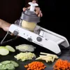A person is using a multi-functional vegetable slicer to prepare food, with various chopped vegetables displayed around the slicer. Náhled obrázku produktu