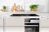 A kitchen counter with an induction hob and oven, showing dimensions. Produktbild-Vorschau