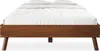 A front view of a wooden bed frame with white bedding. Produktbild-Vorschau