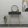 A vanity table with a mirror and makeup accessories, placed in a room with a plant and artwork on the wall. Produktbild-Vorschau