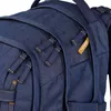 A close-up view of a denim blue backpack. Voir les images du produit