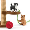 Two toy cats playing with a cat tree and a ball of yarn. Anteprima dell’immagine prodotto