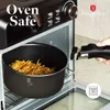 A pot filled with food is being removed from an oven using a pot holder. The oven has controls and a brand logo visible. Voir les images du produit