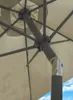Close-up view of the internal mechanism and fabric of a beige umbrella. Produktbild-Vorschau