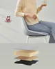 A person sitting on a chair with a mug in hand, and a layered diagram of the chair's cushioning. Náhled obrázku produktu