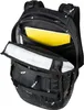 An open black backpack with a yellow notebook inside. Voir les images du produit