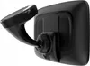 The back of a black navigation device with a suction cup mount attached. Voir les images du produit