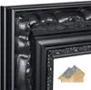 A close-up view of a black ornate picture frame with a cross-section of the frame's material shown in the lower right corner. Produktbild-Vorschau