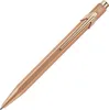 A rose gold CARAN D'ACHE ballpoint pen is shown against a white background. Podgląd zdjęcia produktu