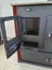 A close-up, angled view of a gray wood-burning stove with its door open, revealing the interior and a drawer. Náhled obrázku produktu