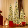 Three artificial Christmas trees with lights and snow, surrounded by gift boxes and lanterns. Podgląd zdjęcia produktu