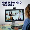 A computer monitor displaying a video conference with four participants, a webcam on top of the monitor, and a keyboard in front. Náhľad obrázku produktu