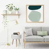 A modern living room scene featuring a side table, a floor lamp, and a sofa with decorative pillows and artwork on the wall. Anteprima dell’immagine prodotto