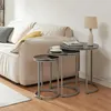 Nesting tables in a living room setting next to a sofa. Anteprima dell’immagine prodotto
