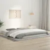 A bedroom scene with a bed, rug, and wall art. Náhled obrázku produktu
