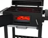 A close-up view of a black charcoal grill with the firebox door open, revealing glowing red coals. Podgląd zdjęcia produktu