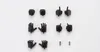 A collection of black plastic model kit hands and accessories laid out on a white background. Podgląd zdjęcia produktu