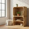 Two wooden crates stacked, one on top of the other, used as shelving. A basket with a blanket is to the left. A window is visible on the left side of the image. Anteprima dell’immagine prodotto