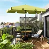 A balcony with plants, furniture, and a large umbrella. Produktbild-Vorschau