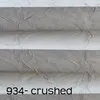 A close-up view of a gray pleated fabric with a textured, crushed appearance, showing horizontal folds and creases. Text indicating the product code and name is visible at the bottom. Produktbild-Vorschau
