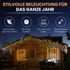 A wooden cabin decorated with icicle-shaped LED lights at night. Produktbild-Vorschau
