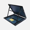 An open, medium-sized indoor table tennis table with a blue surface and black frame, shown from a slightly elevated angle against a light gray background. The table is propped open by its legs, revealing the underside of the top surface and the base. A yel Produktbild-Vorschau