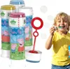 A child is blowing bubbles from a bottle of Peppa Pig branded bubble solution. Podgląd zdjęcia produktu