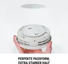 A hand holding a smoke detector with a magnetic mounting plate above it. Produktbild-Vorschau