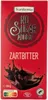 A red chocolate bar wrapper with text and graphics. Produktbild-Vorschau