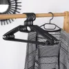 Dix cintres rotatifs en plastique noir - solution pratique Voir les images du produit 2