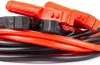 A close-up shot of a coiled set of red and black jumper cables, with the red and black clamps visible at the top. Podgląd zdjęcia produktu