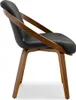 A side view of a modern dining chair with a black seat and wooden frame. Voir les images du produit