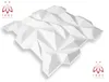 A 3D geometric wall panel is shown against a white background, with logos in the top-left and bottom-right corners. Produktbild-Vorschau