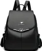 A black leather backpack with a silver kangaroo logo and decorative metal accents. Podgląd zdjęcia produktu