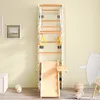 A children's indoor playground set mounted on a wall, featuring a ladder, slide, swing, and rings. Voir les images du produit