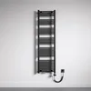 A black electric towel radiator mounted on a textured white wall, with a coiled power cord plugged into a wall socket. Produktbild-Vorschau