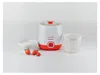 A yogurt maker with a bowl of yogurt and strawberries, and a separate strainer basket. Produktbild-Vorschau