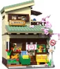 A detailed model of a Japanese-style building, likely a shop, made of building blocks. Produktbild-Vorschau