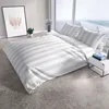 A bedroom scene with a bed, nightstand, and a framed picture. Produktbild-Vorschau