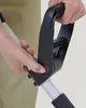A close-up of a person's hands adjusting a part of a garden tool. Produktbild-Vorschau