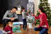 A family is gathered around a Christmas tree, opening an advent calendar. Produktbild-Vorschau