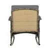 The back view of a rattan rocking chair with a gray cushion. Produktbild-Vorschau