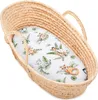 A baby bassinet with a patterned sheet inside. Produktbild-Vorschau