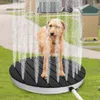 A dog is being showered on a circular platform in a grassy outdoor area. Náhled obrázku produktu